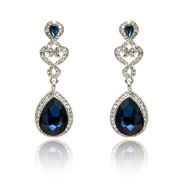 Pair of sapphire earrings isolated on white background